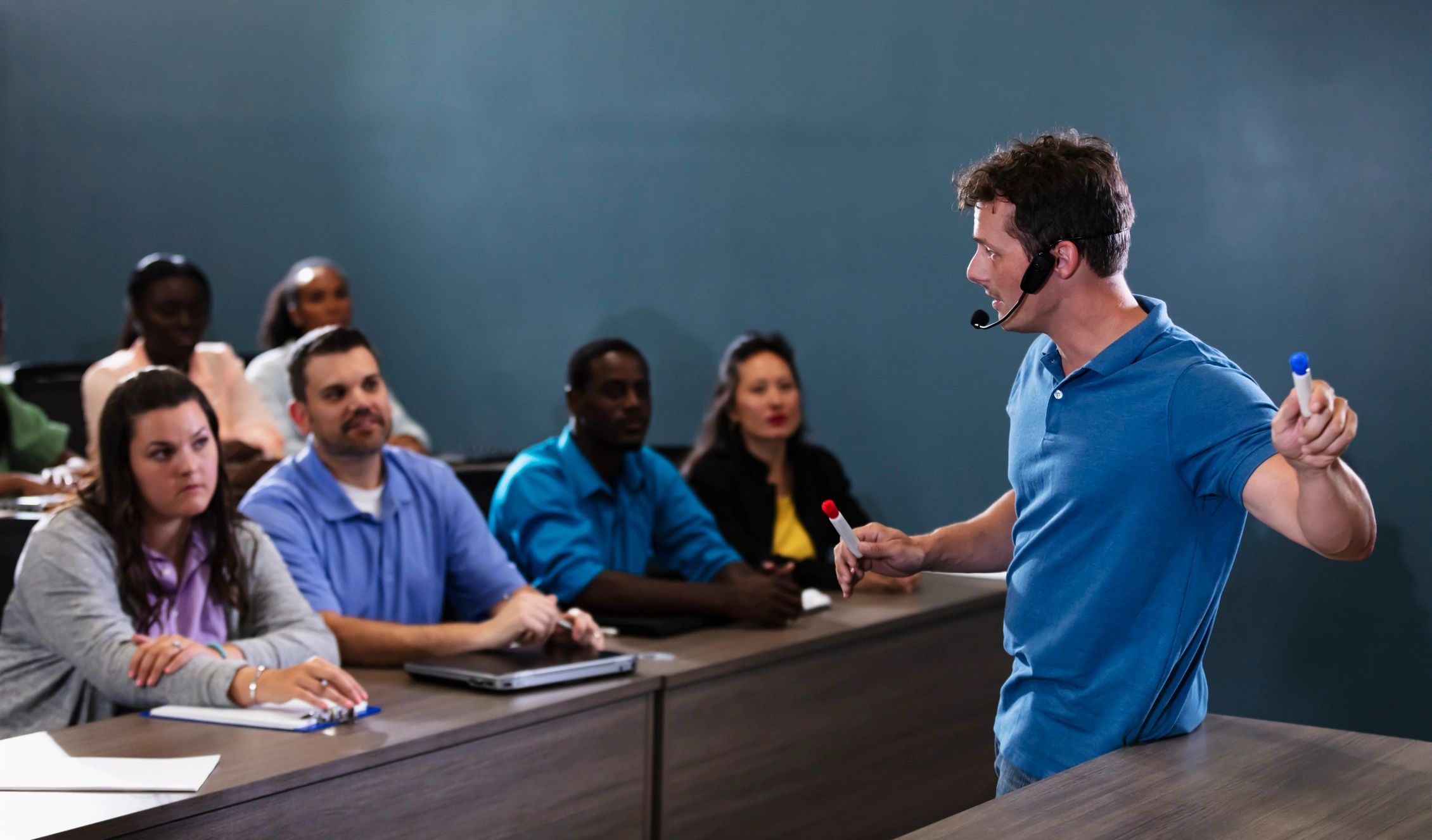 Instructor presenting to a group in a classroom