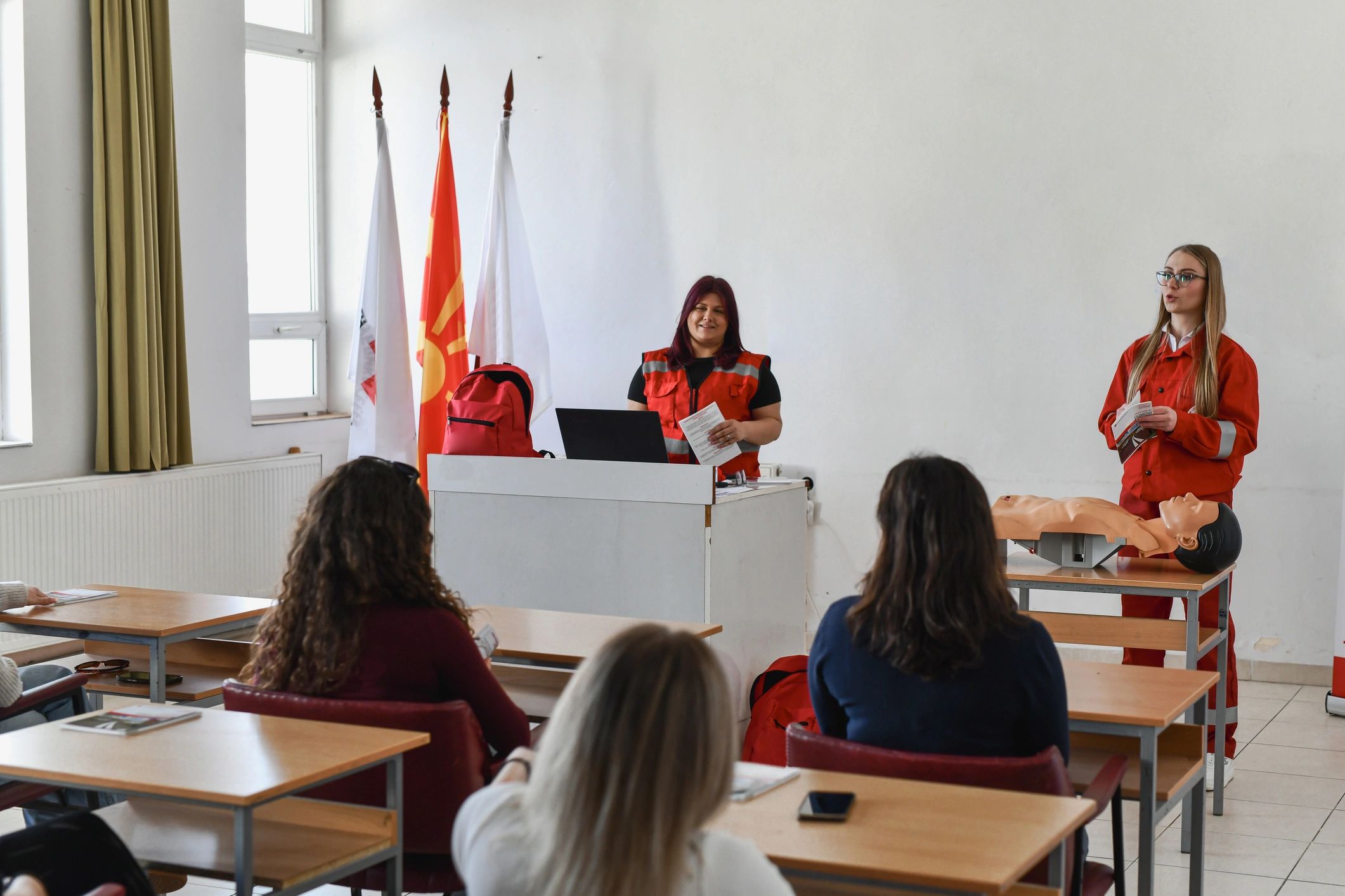 First aid training session in a classroom with instructor and participants